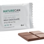 a CBD brownie - salted caramel next to a packet of chocolate.